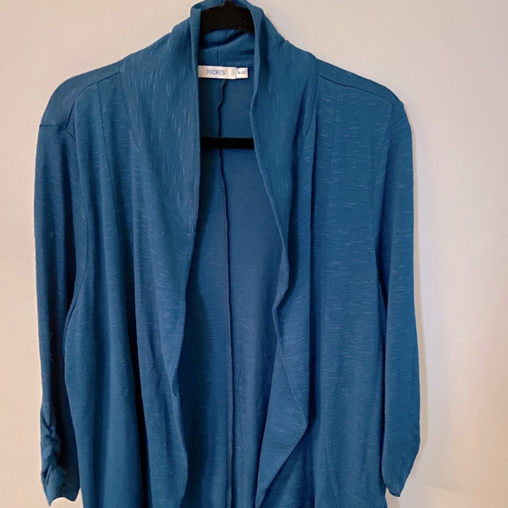 Ricki’s teal cardigan